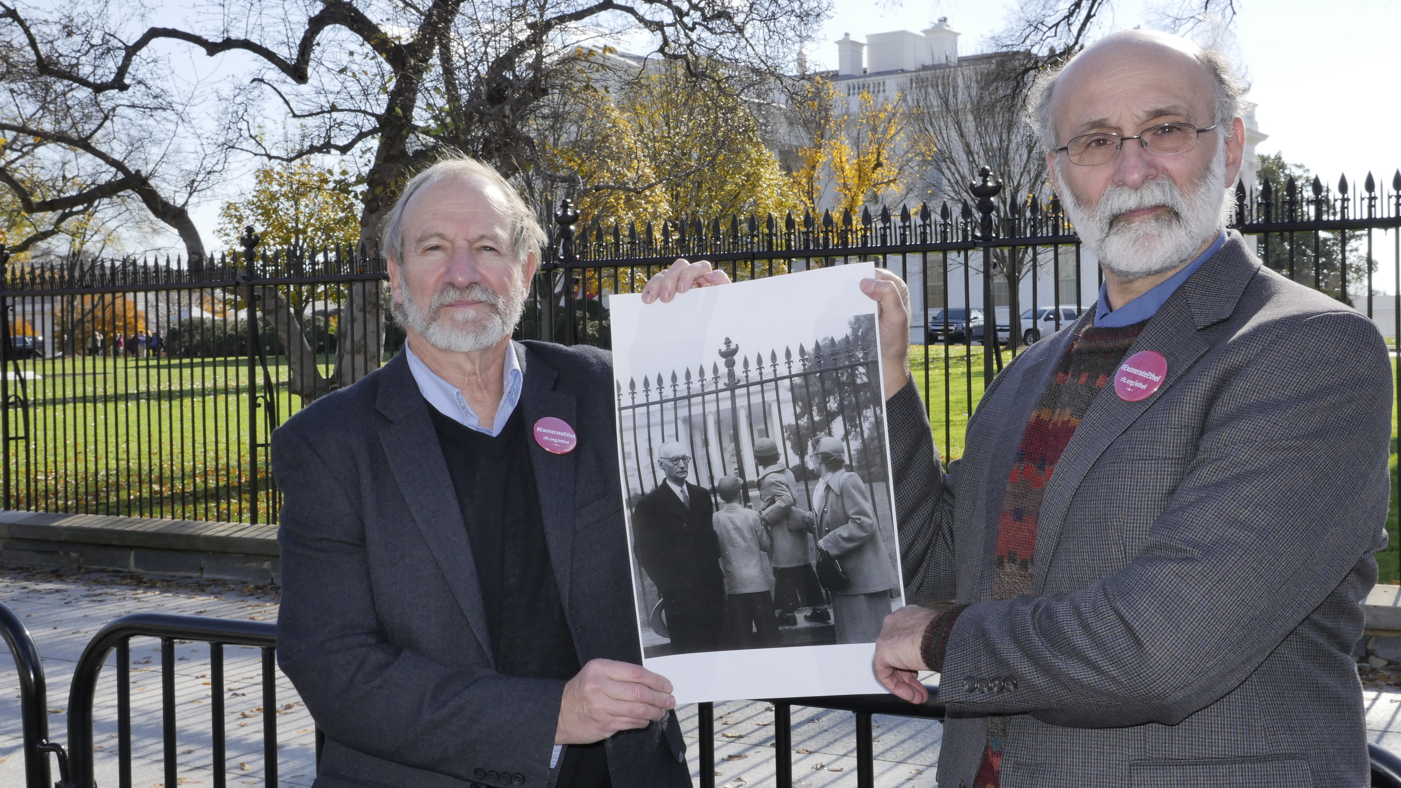 Robert and Michael holding photo of themselves from 1953