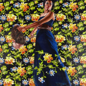 A vivid painting portrays a Black woman in the Biblical role of "Judith" in a dark blue dress and hair done up in an intricate updo on her head. She stands with legs slight apart and faces forward but slightly to the right. Her arms swing to the left of the painting across her body, she holds the severed head of a white man with long brown hair, who portrays the Biblical role of "Holofernes." The background of the painting depicts vivid orange and blue flowers, green leaves & vines all set on black.