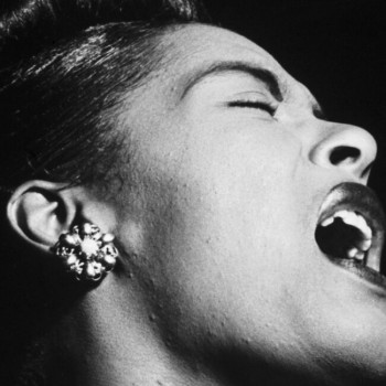 Close-up, black and white photo of Billie Holiday singing