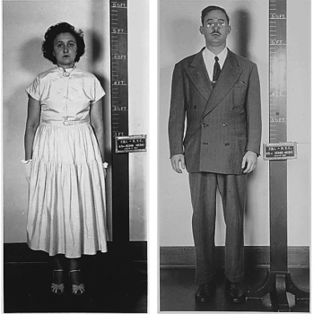 Ethel and Julius Rosenberg after their arrest in 1950. Black/white photo. They each stand against a height chart in their respective, side-by-side photos.