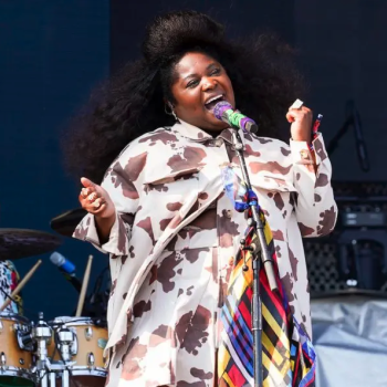 Tank and the Bangas performing. A close-up of lead singer Tarriona “Tank” Ball at the microphone.