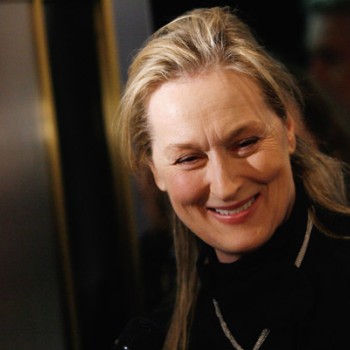 Candid photo of Meryl Streep, who is wearing a black turtleneck and smiling