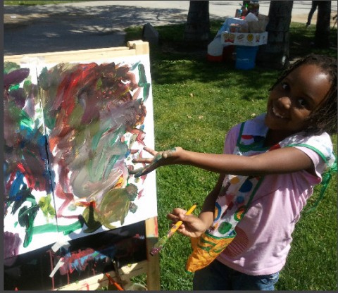 Child showing painting