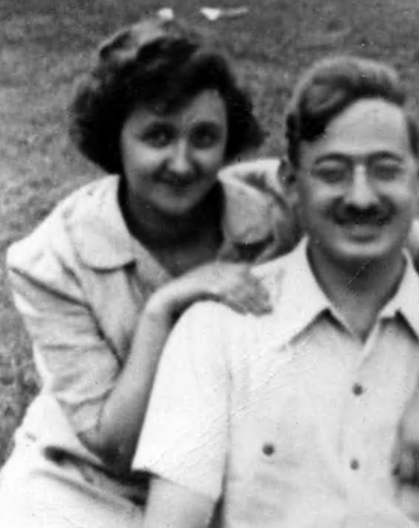Close up, black and white photo of Ethel Rosenberg as a young woman, smiling with her hand on her husband Julius' shoulder