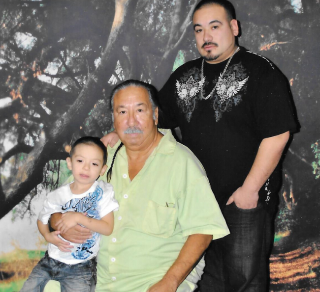 Leonard Peltier with son and grandchild.